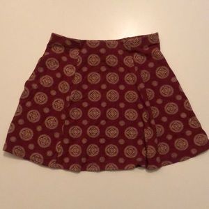 Rust colored patterned mini skirt.